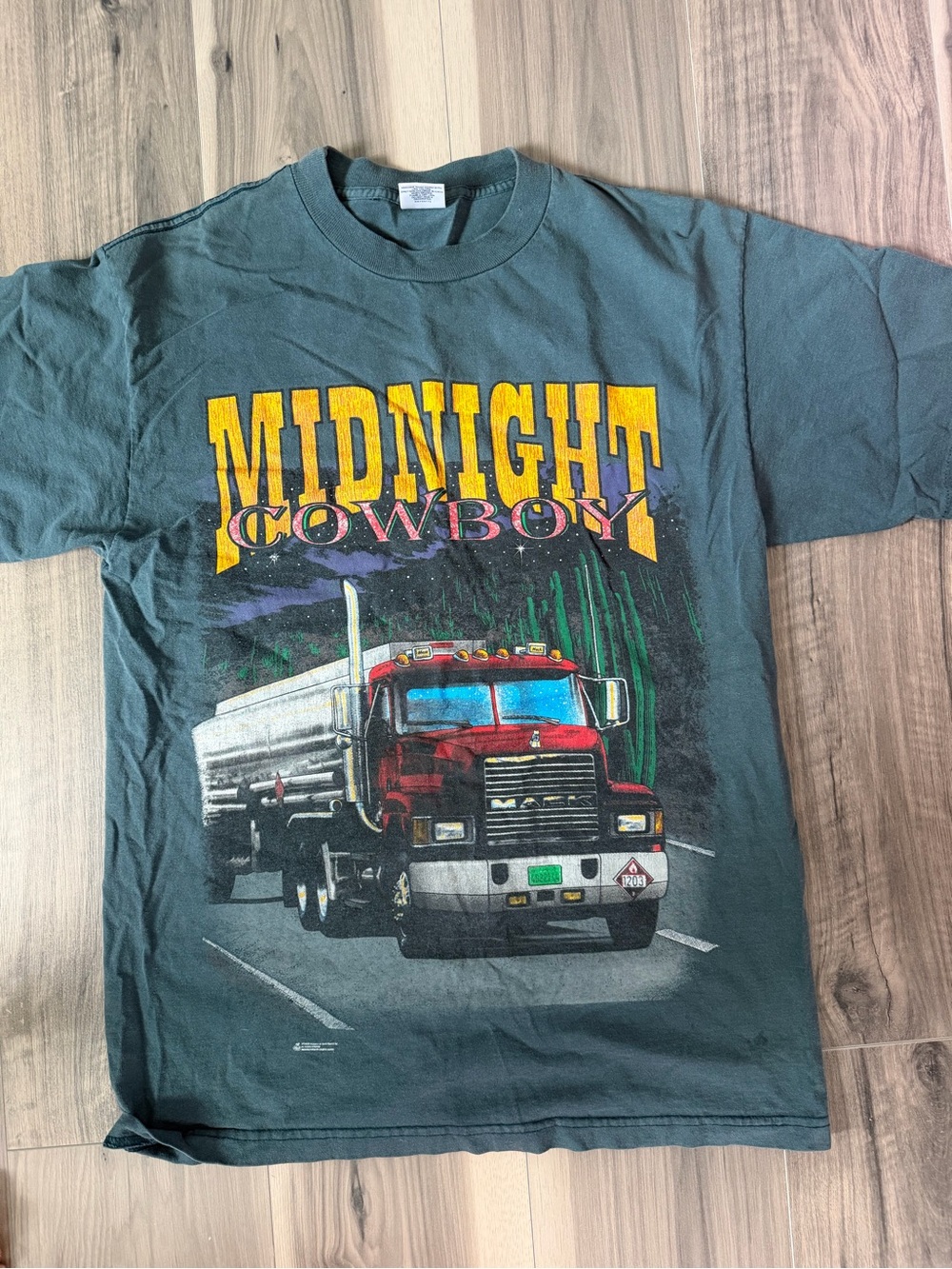 Midnight Cowboy Graphic Tee — Teal Green with Yellow Print